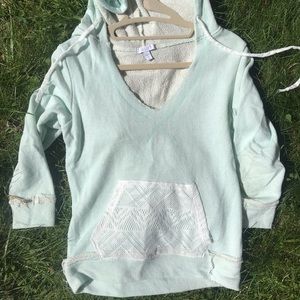 Quarter length sweatshirt with hood